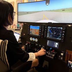 Aviator NYC - Student practicing taxi and runway procedures during a guided flight simulator lesson at Aviator NYC.