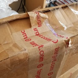 Target Central Return Center - This is *not* the proper way to reinforce a package for shipping.