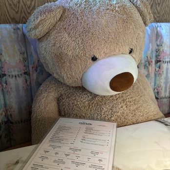 The Charlotte American Bistro - Bear perusing menu - Bars Near Me - Dallas, Texas The Charlotte American Bistro - Bear perusing menu - Bars Near Me - Dallas, Texas
