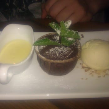 Bogart's - Chocolate fondant with vanilla bean ice cream and vanilla sauce. - Modern European Near Me - Apeldoorn, GE