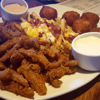 Outback Steakhouse - Outback sampler: onion blossoms, loaded fries and Mac and cheese bites. - Steakhouses Near Me - Charlotte, North Carolina Outback Steakhouse - Outback sampler: onion blossoms, loaded fries and Mac and cheese bites. - Steakhouses Near Me - Charlotte, North Carolina