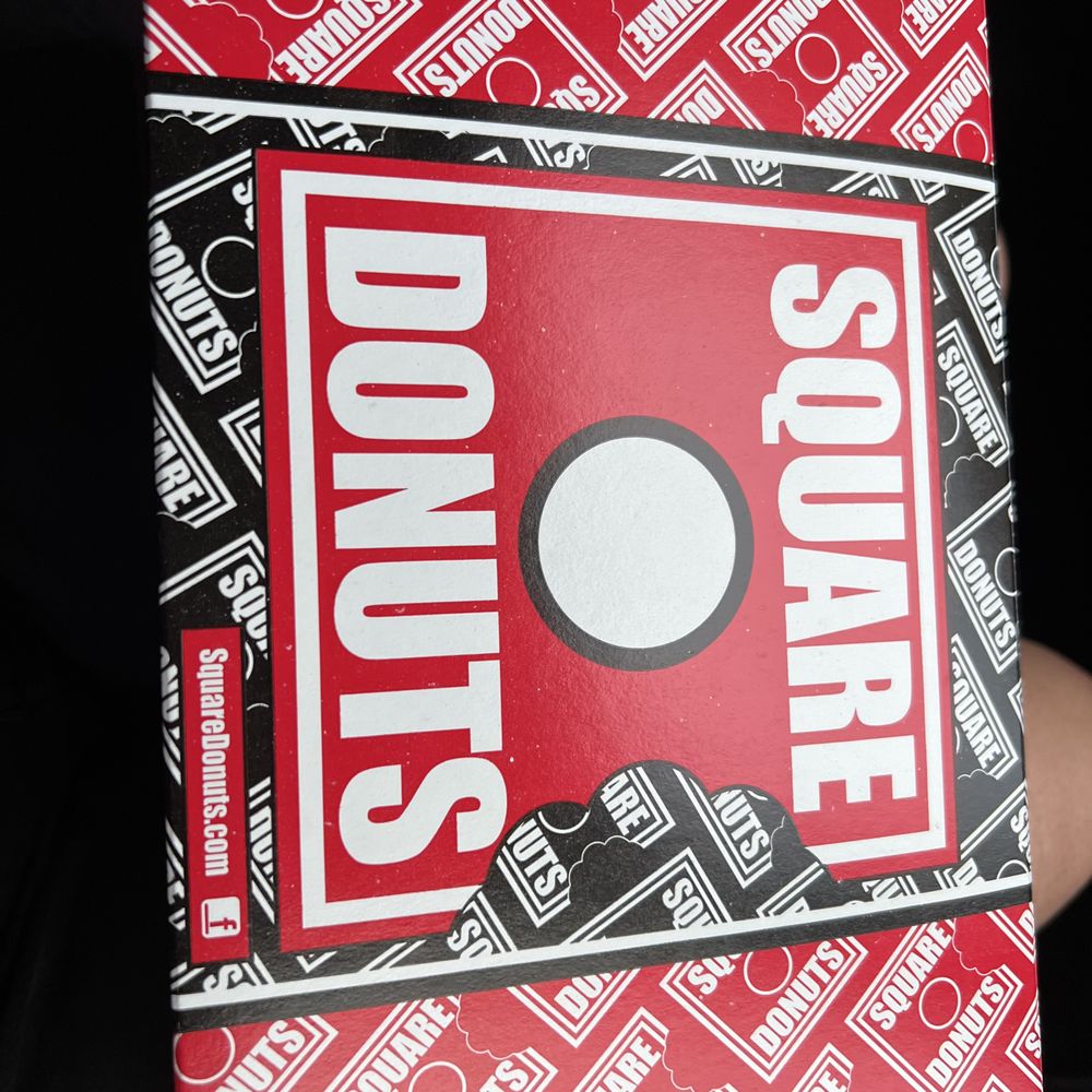 Square Donuts - a person holding a box of donuts - Donuts Near Me - Bloomington, Indiana Square Donuts - a person holding a box of donuts - Donuts Near Me - Bloomington, Indiana