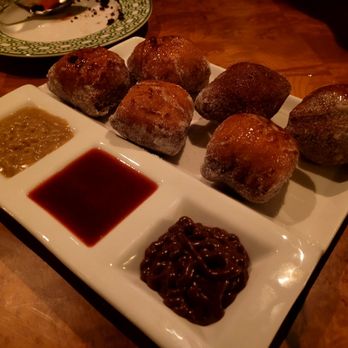 Lilian's - Beignets with butterscotch, strawberry coulis, and chocolate cognac. - Seafood Near Me - Rancho Santa Fe, California Lilian's - Beignets with butterscotch, strawberry coulis, and chocolate cognac. - Seafood Near Me - Rancho Santa Fe, California