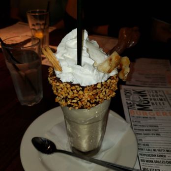 Lucky Monk - King shake! Peanut butter shake adorned with caramelized banana, a Nutter Butter cookie and chocolate-covered bacon! - American Near Me - Barrington, Illinois Lucky Monk - King shake! Peanut butter shake adorned with caramelized banana, a Nutter Butter cookie and chocolate-covered bacon! - American Near Me - Barrington, Illinois