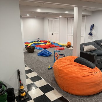 Expert Level Home Services - Try adding warmth and class to a dated basement with a new black drop ceiling and vinyl plank flooring installation! - Handyman Near Me