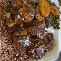Moe’z Tropical Cuisine - Oxtails and collards.