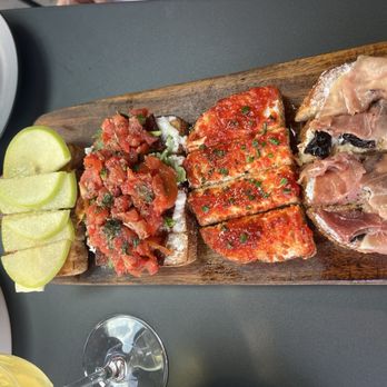 Postino 12 South - Bruschetta Board: Apple Fig Bacon Tomato Jam and Goat Cheese Fig and Prosciutto - Wine Bars Near Me - Nashville, Tennessee Postino 12 South - Bruschetta Board: Apple Fig Bacon Tomato Jam and Goat Cheese Fig and Prosciutto - Wine Bars Near Me - Nashville, Tennessee
