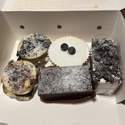 a variety of pastries in a box