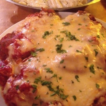 Rich & Charlie's - Veal parmesan with side of cavatelli in white garlic sauce - Italian Near Me - Chesterfield, Missouri Rich & Charlie's - Veal parmesan with side of cavatelli in white garlic sauce - Italian Near Me - Chesterfield, Missouri