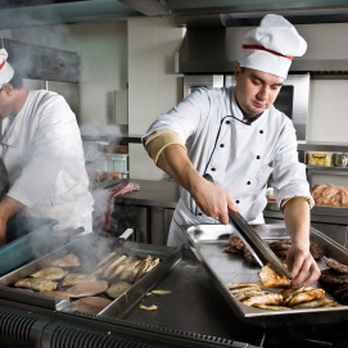 Windsor Rose - two chefs preparing food in a commercial kitchen - Gastropubs Near Me - Calgary, Alberta Windsor Rose - two chefs preparing food in a commercial kitchen - Gastropubs Near Me - Calgary, Alberta