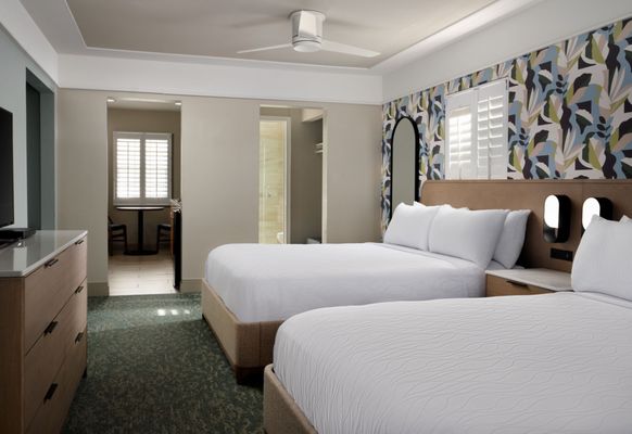 Diamond Head Inn - A hotel room with two queen beds in Pacific Beach, offering a comfortable and practical setup for your stay. - San Diego, CA