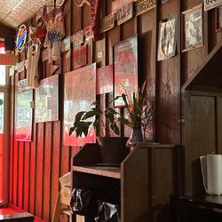 Chicken N More - A clean area to place silverware and other things with clean well taken care of garbages. Continued memorabilia.