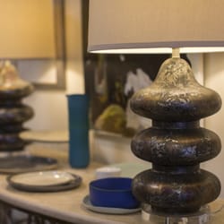 MACK Home - Matching unique rusted-stone textured side lamps & handmade ceramic saucers, accents atop narrow rounded side wall table