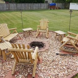 Lakeland Mills - Lakeland Rocking chairs, loveseats, and end tables around a firepit