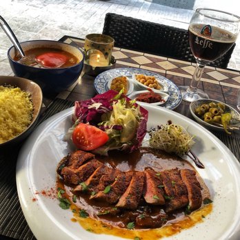 Koutoubiya - Lamb fillet, fine couscous, vegetables & condiments. Meat tender & so flavorful. Couscous & vegetables OK. - Moroccan Near Me - Leuven, VBR Koutoubiya - Lamb fillet, fine couscous, vegetables & condiments. Meat tender & so flavorful. Couscous & vegetables OK. - Moroccan Near Me - Leuven, VBR