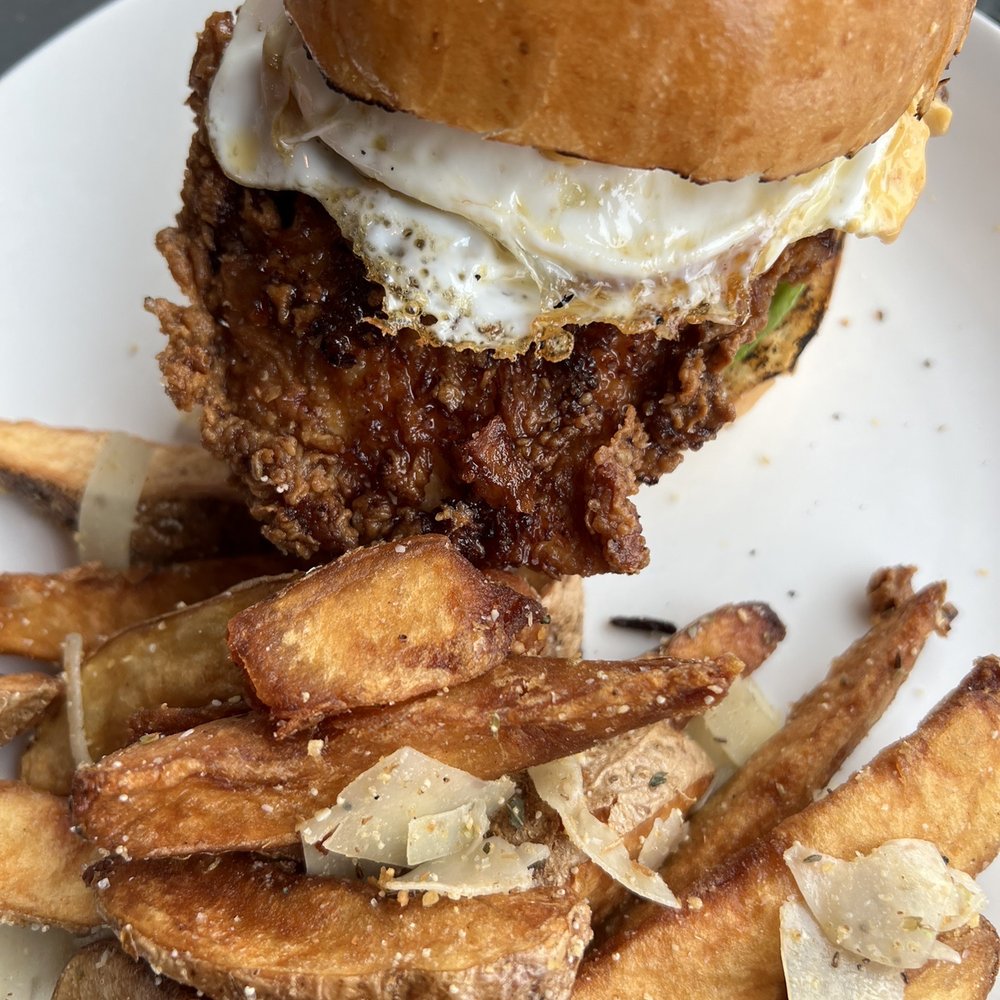 Essie's Restaurant - Crispy Chicken Sandwich with egg and Essie's Hand Cut Everything Bagel Wedges - New American Near Me - Poughkeepsie, New York Essie's Restaurant - Crispy Chicken Sandwich with egg and Essie's Hand Cut Everything Bagel Wedges - New American Near Me - Poughkeepsie, New York
