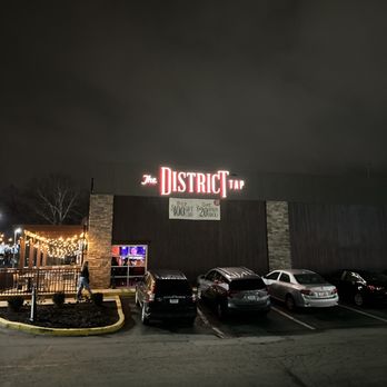 The District Tap - cars parked in a parking lot - Sports Bars Near Me - Indianapolis, Indiana The District Tap - cars parked in a parking lot - Sports Bars Near Me - Indianapolis, Indiana