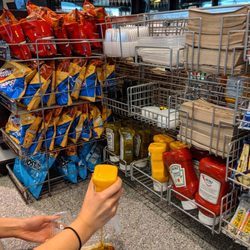Inside. Hot dog condiment stand.
