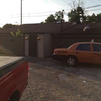 Hickory Pit Stop - a taxi cab parked in front of a garage - Barbeque Near Me - Evansville, Indiana Hickory Pit Stop - a taxi cab parked in front of a garage - Barbeque Near Me - Evansville, Indiana