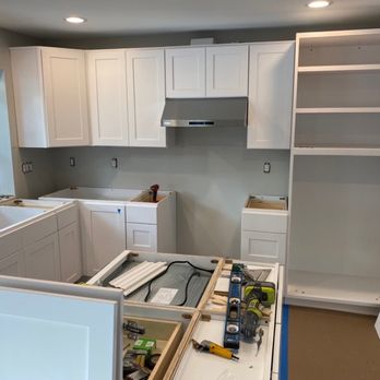 Kay Construction - Cabinet assembly, note the drawer microwave in the island - General Contractors Near Me