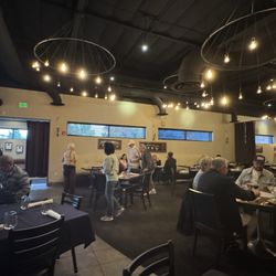 Bistro 7 - Happy hour is just ending at Bistro 7 and now a Saturday Dinner crowd is coming in. The restaurant is buzzing with people. Julie A