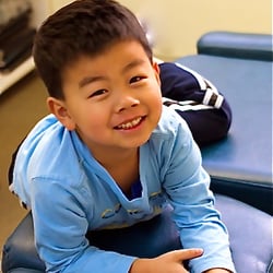 Mark Wong, DC - A happy chiropractic kid after treatment