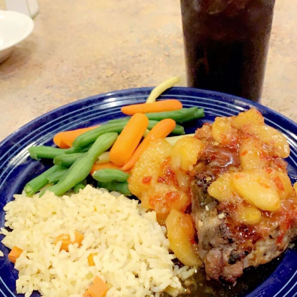 Feathers Cafe - Pork hops with grilled apples and rice pilaf - Cafes Near Me - Laughlin, Nevada Feathers Cafe - Pork hops with grilled apples and rice pilaf - Cafes Near Me - Laughlin, Nevada