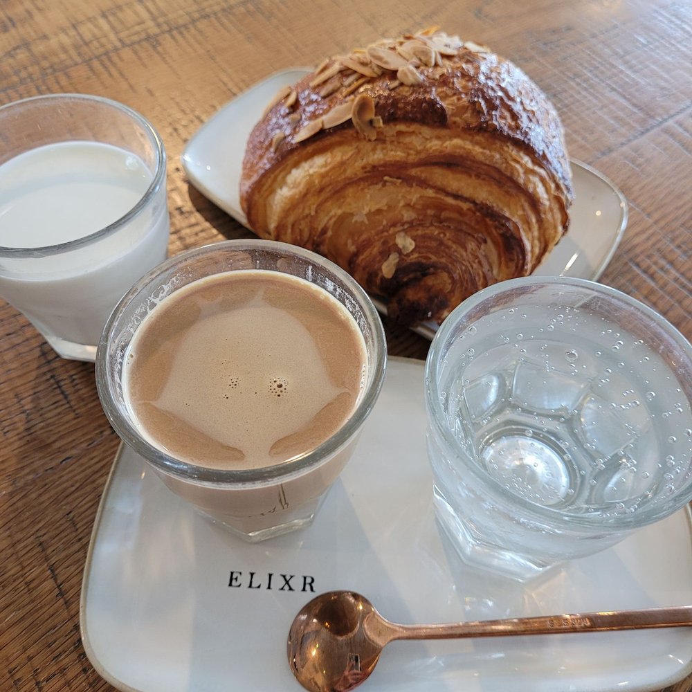 Elixr Coffee Roasters - Kopi Sanger and an almond croissant - Cafes Near Me - State College, Pennsylvania Elixr Coffee Roasters - Kopi Sanger and an almond croissant - Cafes Near Me - State College, Pennsylvania