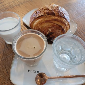Elixr Coffee Roasters - Kopi Sanger and an almond croissant - Cafes Near Me - State College, Pennsylvania Elixr Coffee Roasters - Kopi Sanger and an almond croissant - Cafes Near Me - State College, Pennsylvania