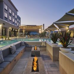 In-pool fire pit lounge available for rent on ResortPass or through the restaurant