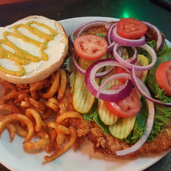 The Blind Pig - Breaded tenderloin $11 plus curly fries $2 - Sports Bars Near Me - Cedar Rapids, Iowa
