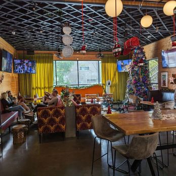 Patterson Park - people sitting at tables in a restaurant - Bars Near Me - Houston, Texas