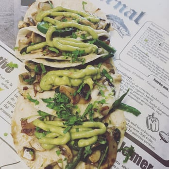 El Trompo Movil - two tacos on a newspaper - Food Trucks Near Me El Trompo Movil - two tacos on a newspaper - Food Trucks Near Me