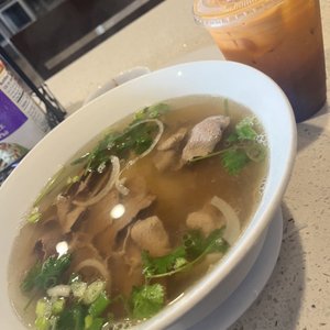 Photo of PB Pho & Grill - San Diego, CA, United States. Filet pho with Thai tea! I also love their spring rolls! I come here too much! The service is quick and friendly! Definitely recommend!