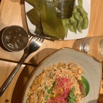 Malai Kitchen - Chicken pad Thai accompanied by the complimentary sticky rice and egg plant sauce - Thai Near Me - Fort Worth, Texas Malai Kitchen - Chicken pad Thai accompanied by the complimentary sticky rice and egg plant sauce - Thai Near Me - Fort Worth, Texas