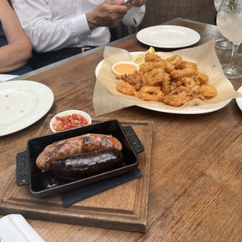 Quinto - Fried calamari, chorizo and blood sausage - Steakhouses Near Me - Miami, Florida Quinto - Fried calamari, chorizo and blood sausage - Steakhouses Near Me - Miami, Florida