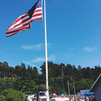 World's Largest Salmon BBQ - an american flag flying in the wind - Barbeque Near Me - Fort Bragg, California World's Largest Salmon BBQ - an american flag flying in the wind - Barbeque Near Me - Fort Bragg, California