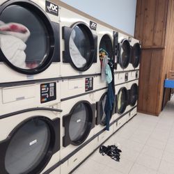 Lake City Laundromat - This dryer wasn't done but it popped open during the cycle and this person's clothes are falling onto the floor