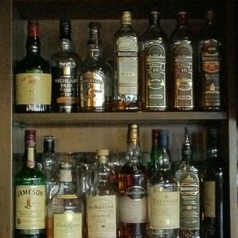 Dixons Public House - a shelf full of liquor bottles - Pubs Near Me - Calgary, Alberta Dixons Public House - a shelf full of liquor bottles - Pubs Near Me - Calgary, Alberta