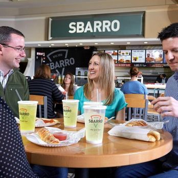 Sbarro - a group of people sitting at a table - Italian Near Me - White Hills, Arizona
