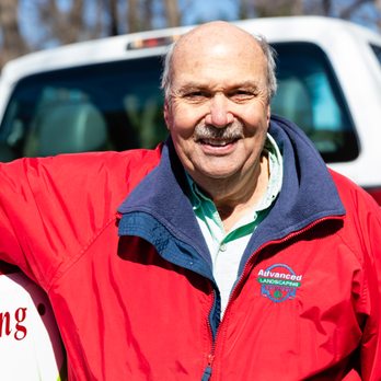 Advanced Landscape Services - a man holding a surfboard - Landscaping Near Me - Morristown, Tennessee