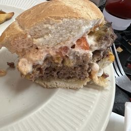 Double bison burger with ketchup mayo cheddar and tomato