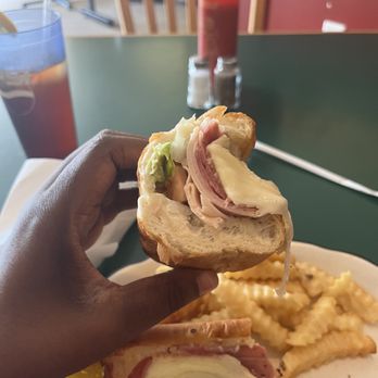 Juliana Pizza - a hand holding a half eaten sandwich - Pizza Near Me - Charlotte, North Carolina Juliana Pizza - a hand holding a half eaten sandwich - Pizza Near Me - Charlotte, North Carolina