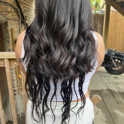 Julie's Salon - "So called extensions" the top half is MY hair, the couple strands at the bottom is what she installed.