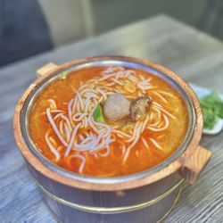 Red Oil Numbing Spicy Beef Stone Pot Rice Noodle Soup ($23.99)