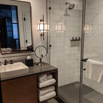 Crossroads Hotel - I love all the touches in this spacious and clean bathroom, including the cool sconce. - Hotels Near Me - Kansas City, Missouri