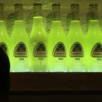 Diego Pops - Decor - a wall full of lime flavored Jarritos lit up! - Cocktail Bars Near Me - Scottsdale, Arizona Diego Pops - Decor - a wall full of lime flavored Jarritos lit up! - Cocktail Bars Near Me - Scottsdale, Arizona