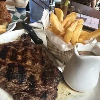 Hibernian Restaurant & Pub - Steak Frites comes with this whiskey peppercorn sauce that was so good! - Irish Near Me - Raleigh, North Carolina