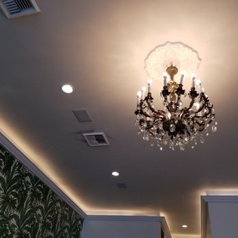 Chaumont - Love the chandelier with tropical wallpaper contrast - Bakeries Near Me - Beverly Hills, California