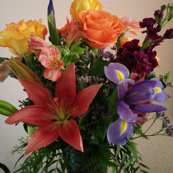 Rosemar Flowers & Gifts - Told her orange roses with iris's with mix of colors. Came out amazing. This is only one side. - Florists Near Me - Camarillo, California Rosemar Flowers & Gifts - Told her orange roses with iris's with mix of colors. Came out amazing. This is only one side. - Florists Near Me - Camarillo, California